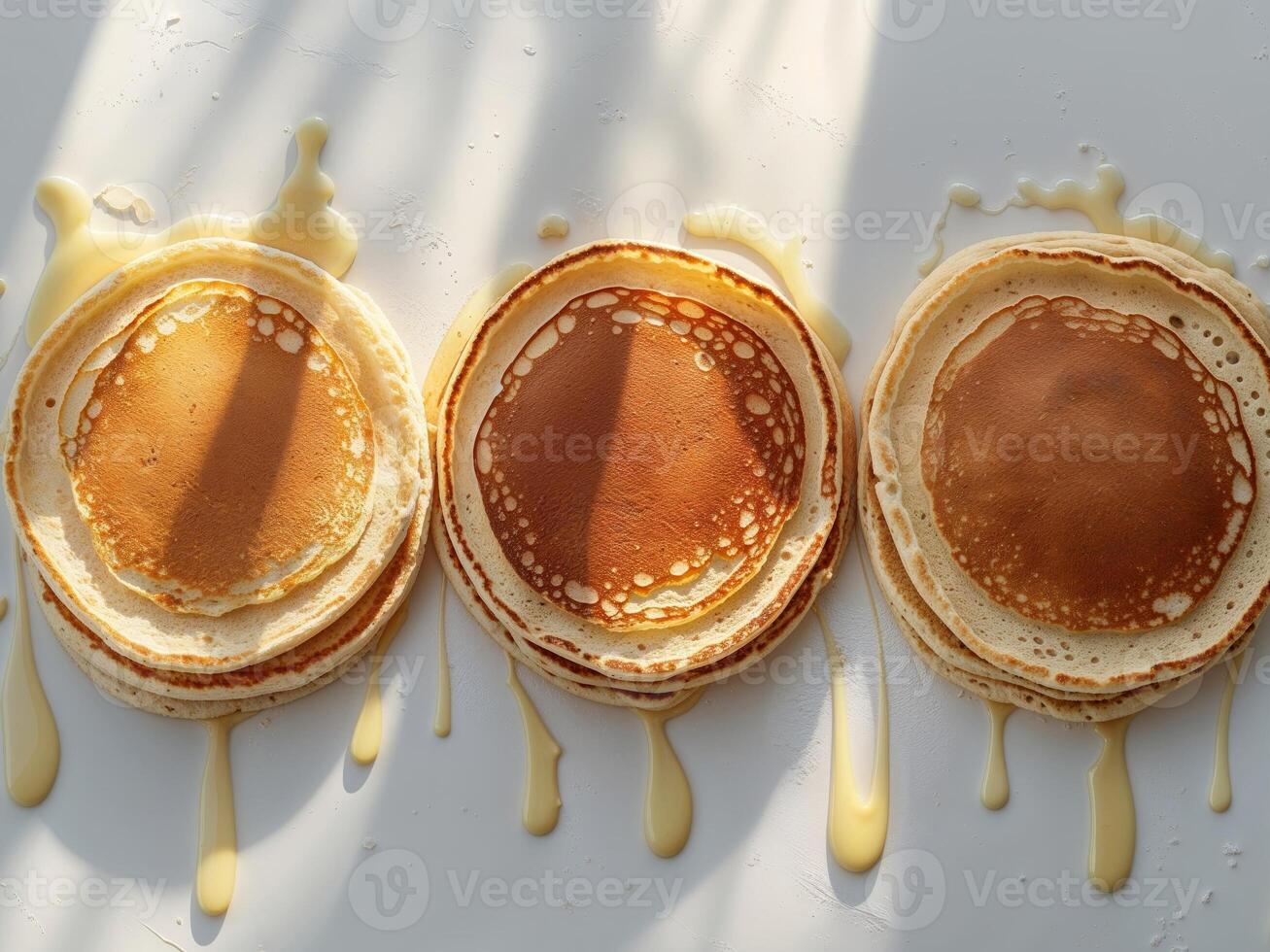 Three golden brown pancakes arranged in a row. photo