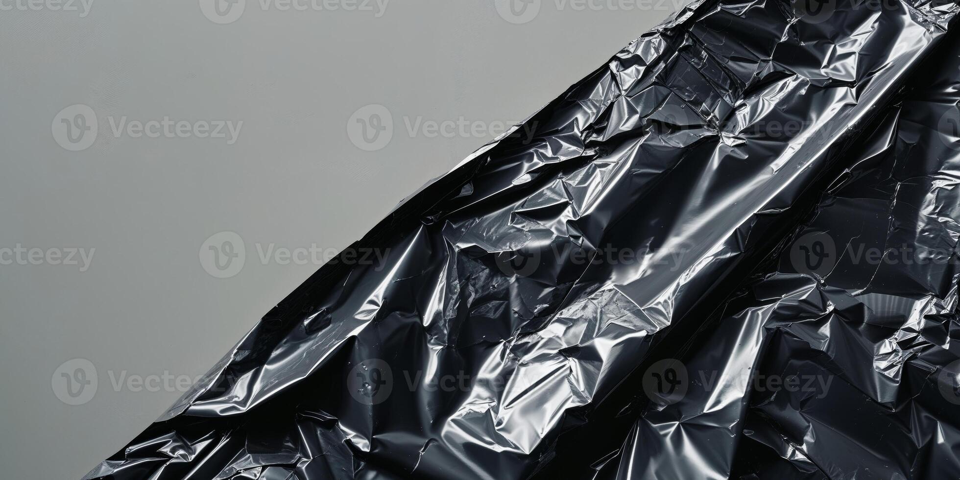 Black crumpled and creased plastic poster texture. photo