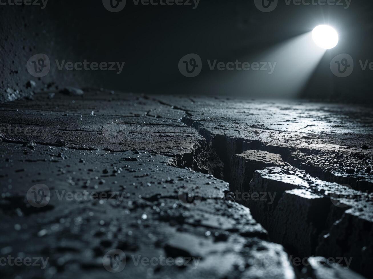 Grunge background with a crack in the ground and a spotlight. photo