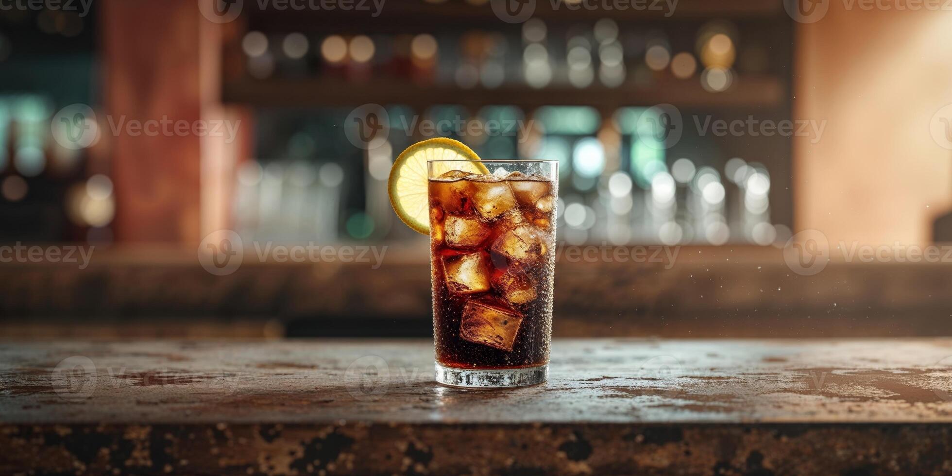 A glass of cola with ice and lemon photo