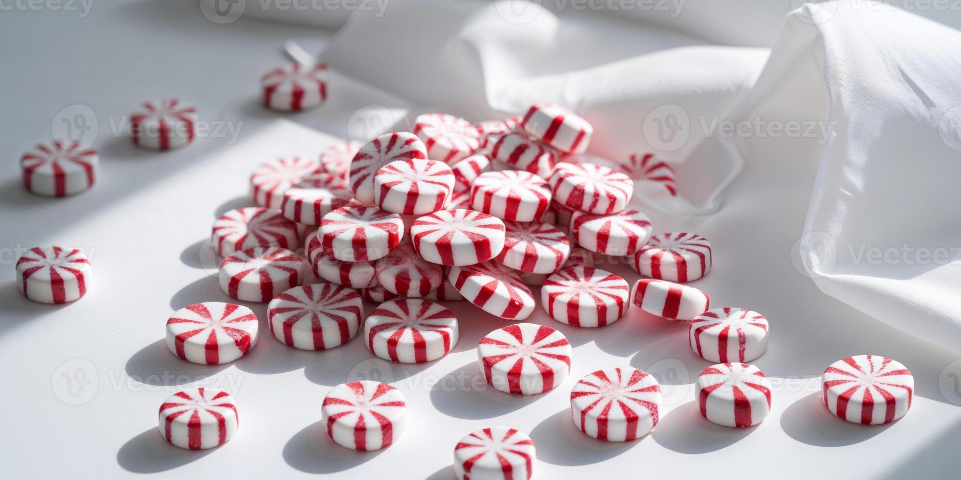 A pile of red and white candy canes photo