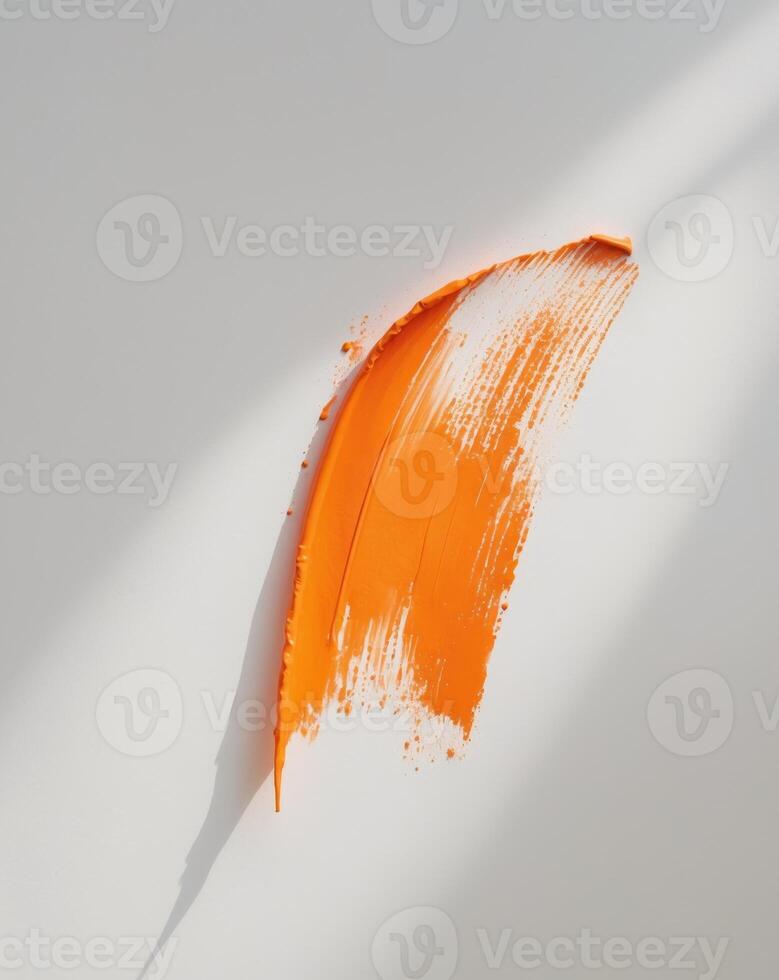 Orange brush stroke with visible texture. photo