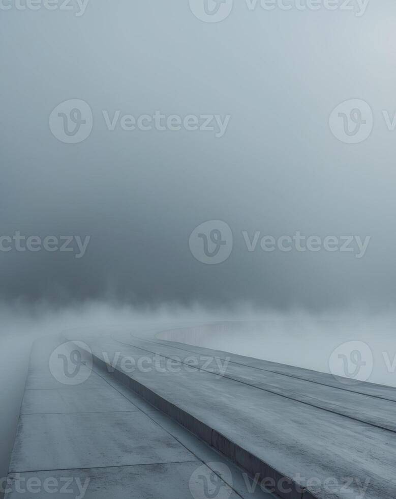 A long bridge is covered in fog and water photo