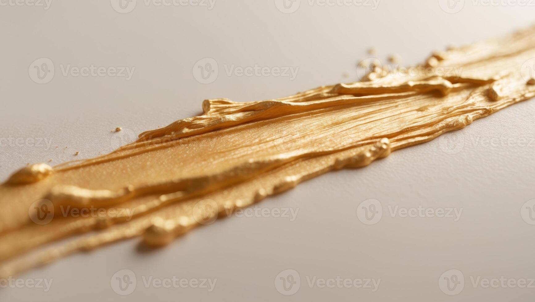 Brush stroke in a warm golden hue with a textured surface photo