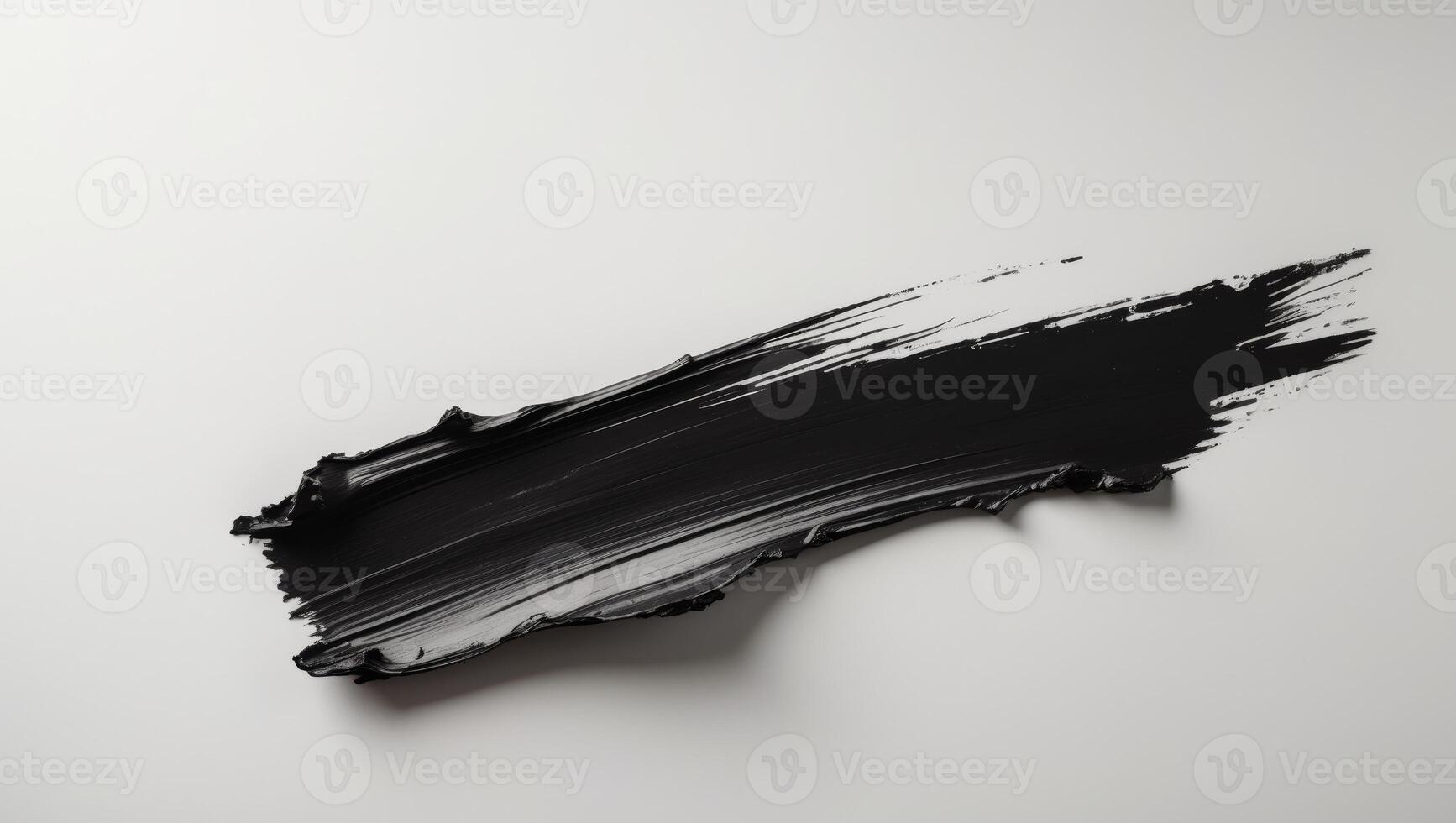 A bold black brushstroke with rough edges creates a dramatic textured effect. photo