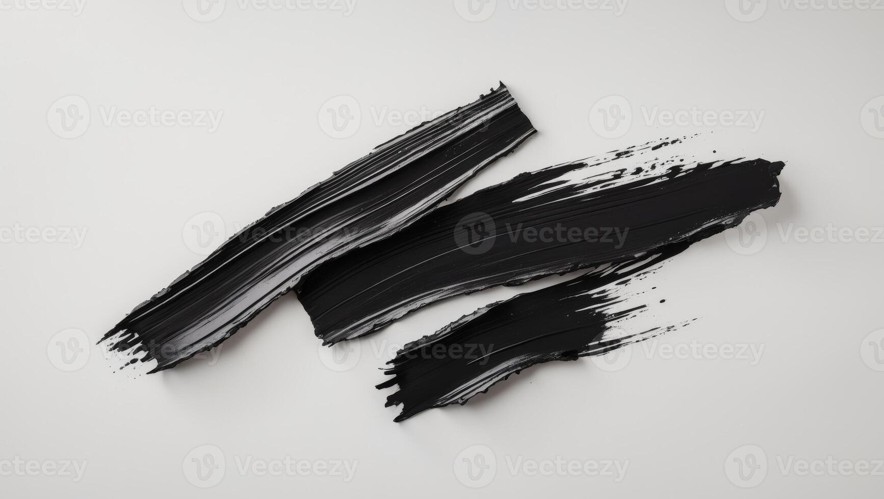 A bold black brushstroke with rough edges creates a dramatic textured effect photo