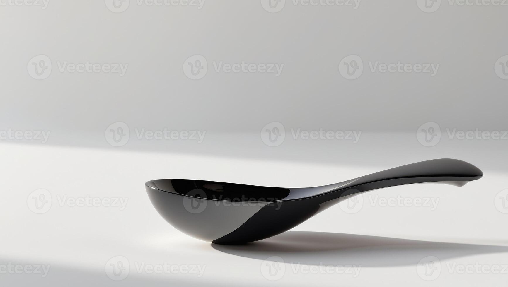 Black spoon with a sleek design and a reflective surface photo