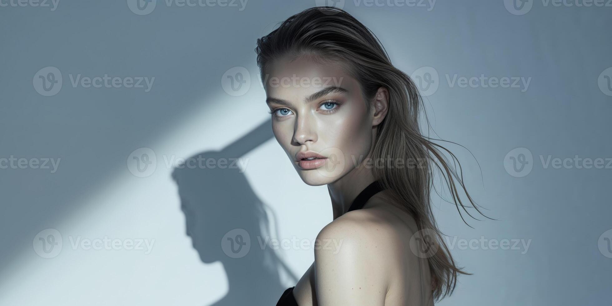 Fashion Model Posing Boldly Under Sharp Studio Light photo