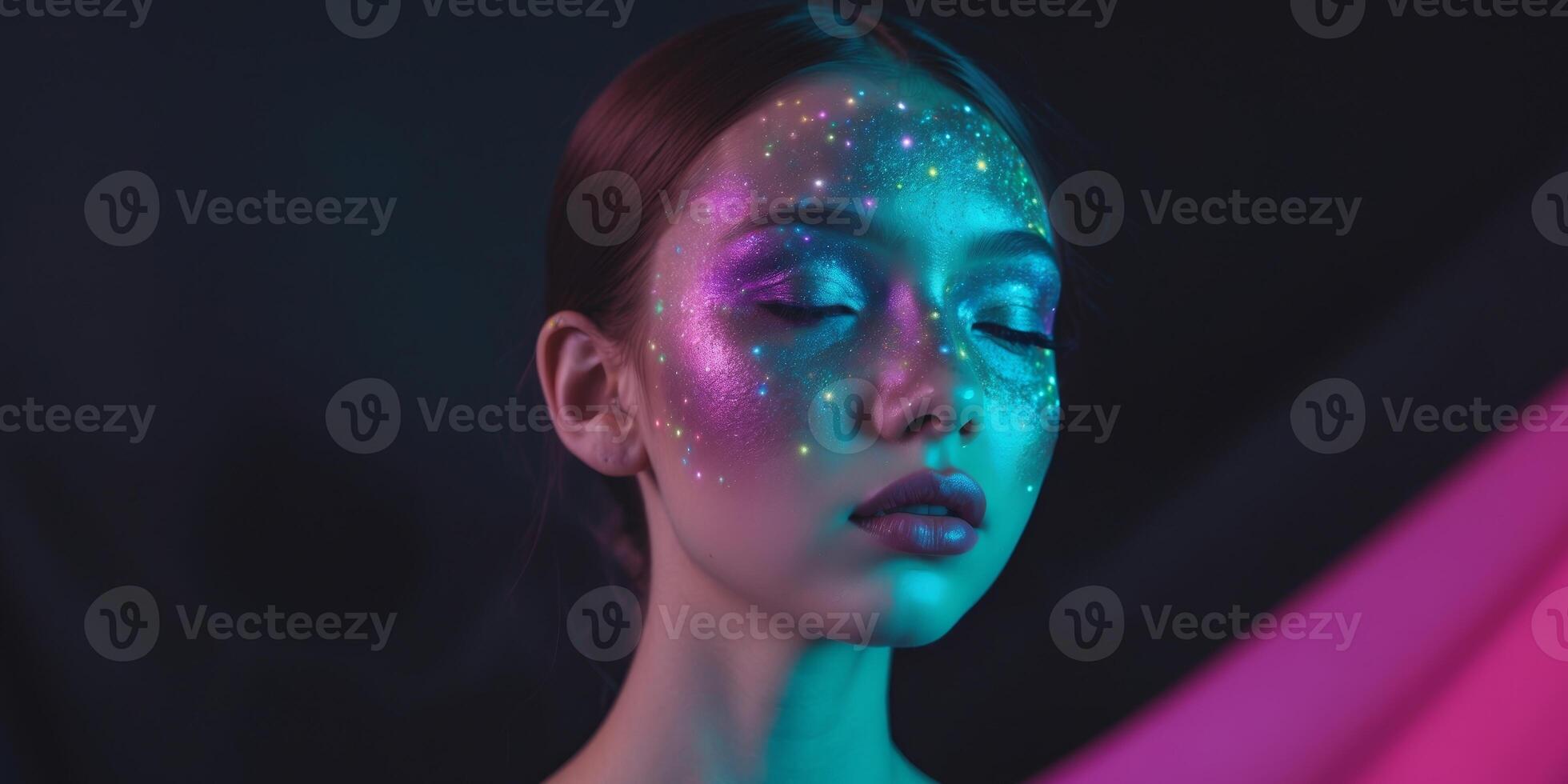 A woman with neon makeup and glitter on her face photo