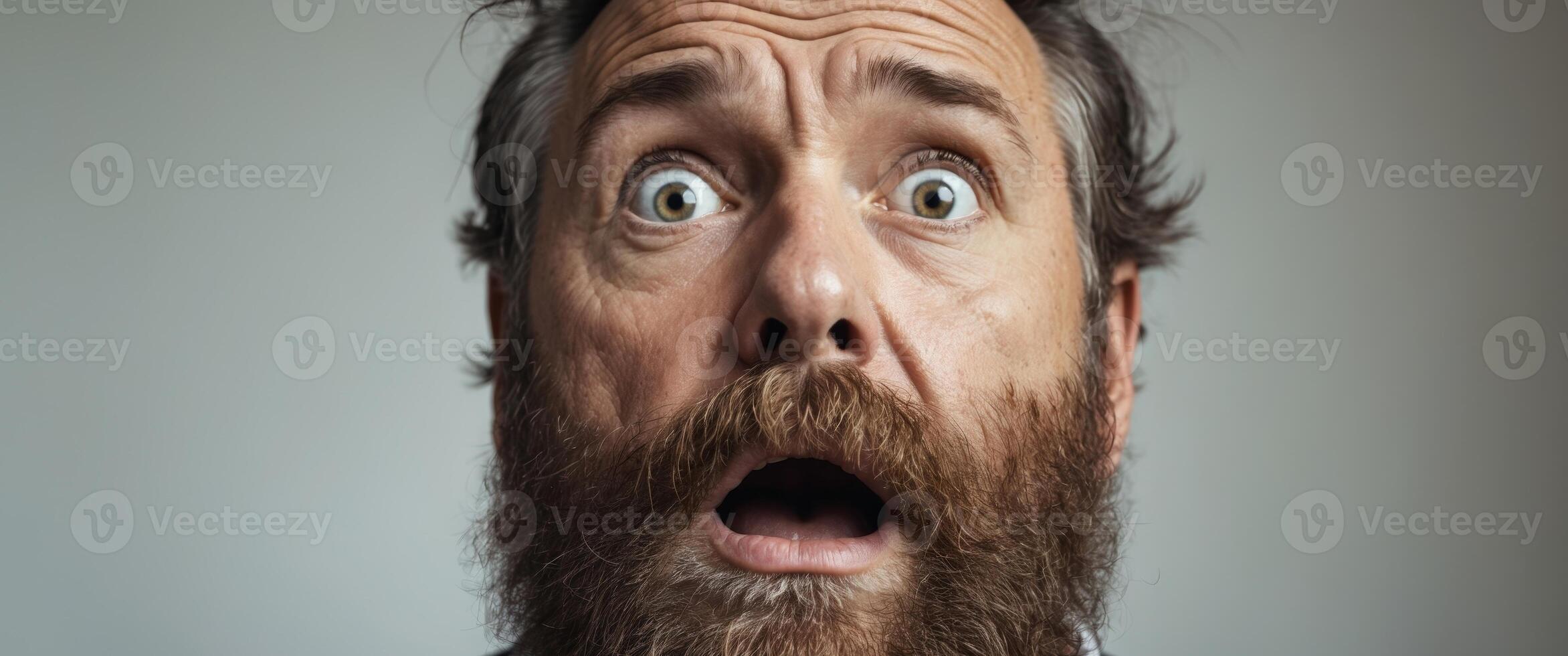 A man with a beard and a shocked expression photo