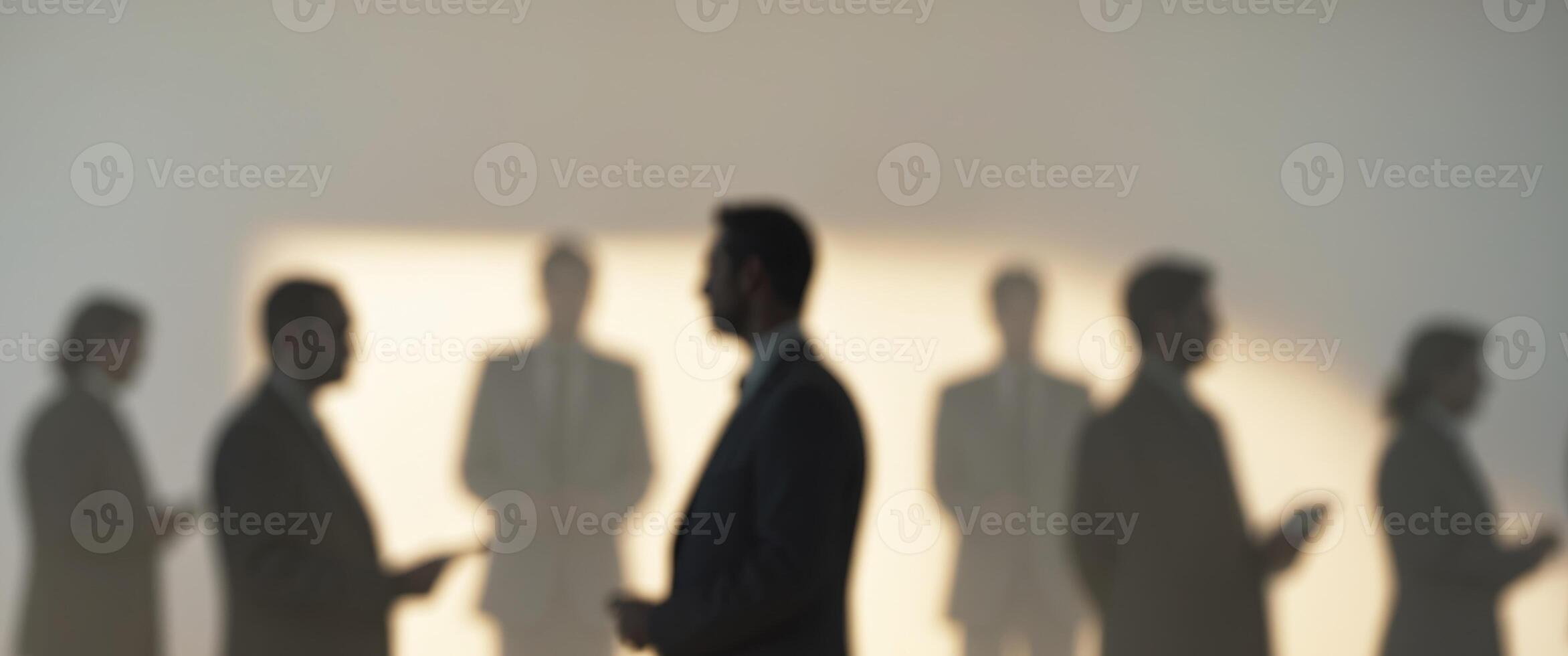 Silhouettes of business people standing in a line photo