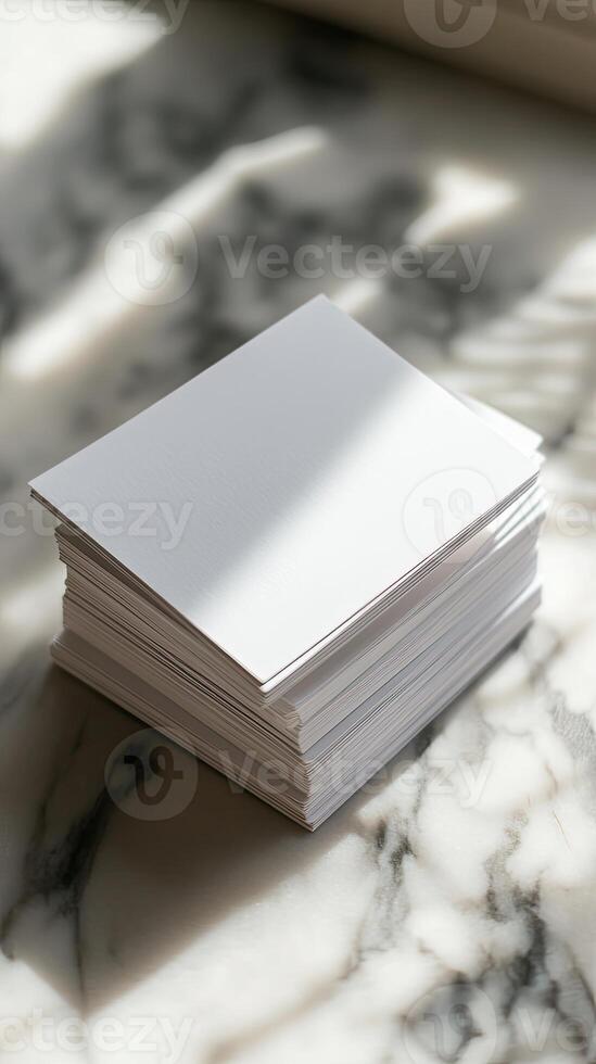 Stack of White Business Cards on Marble Surface photo