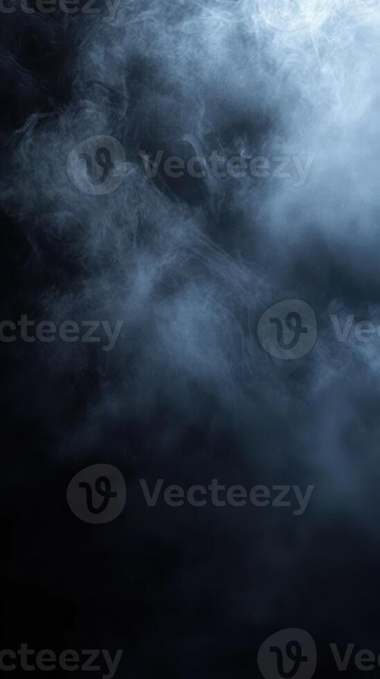 Mysterious wisps of smoke swirl in a dark backdrop creating an atmospheric contrast photo