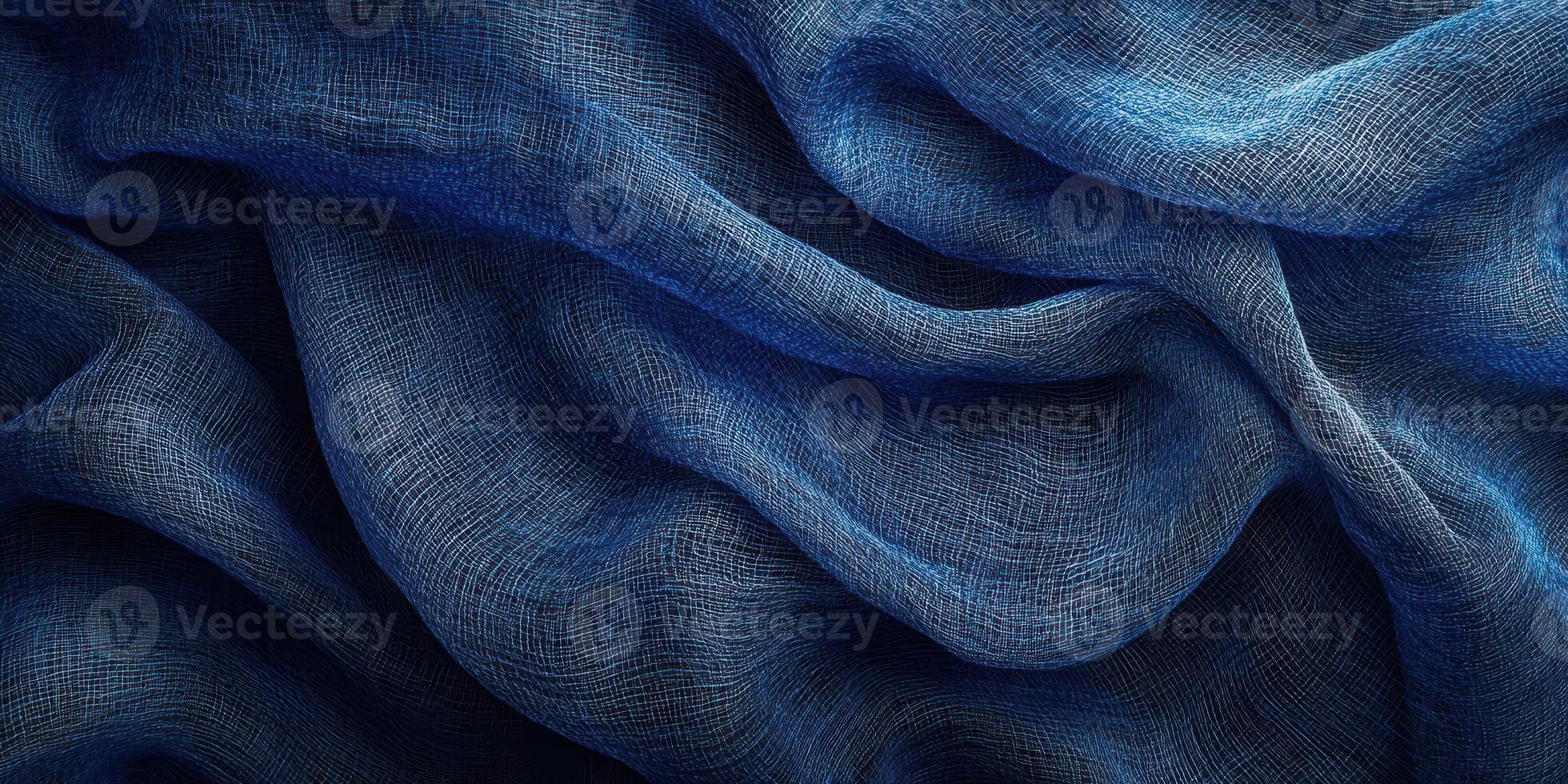 Flowing blue fabric creates a sense of movement and depth in a textured background photo
