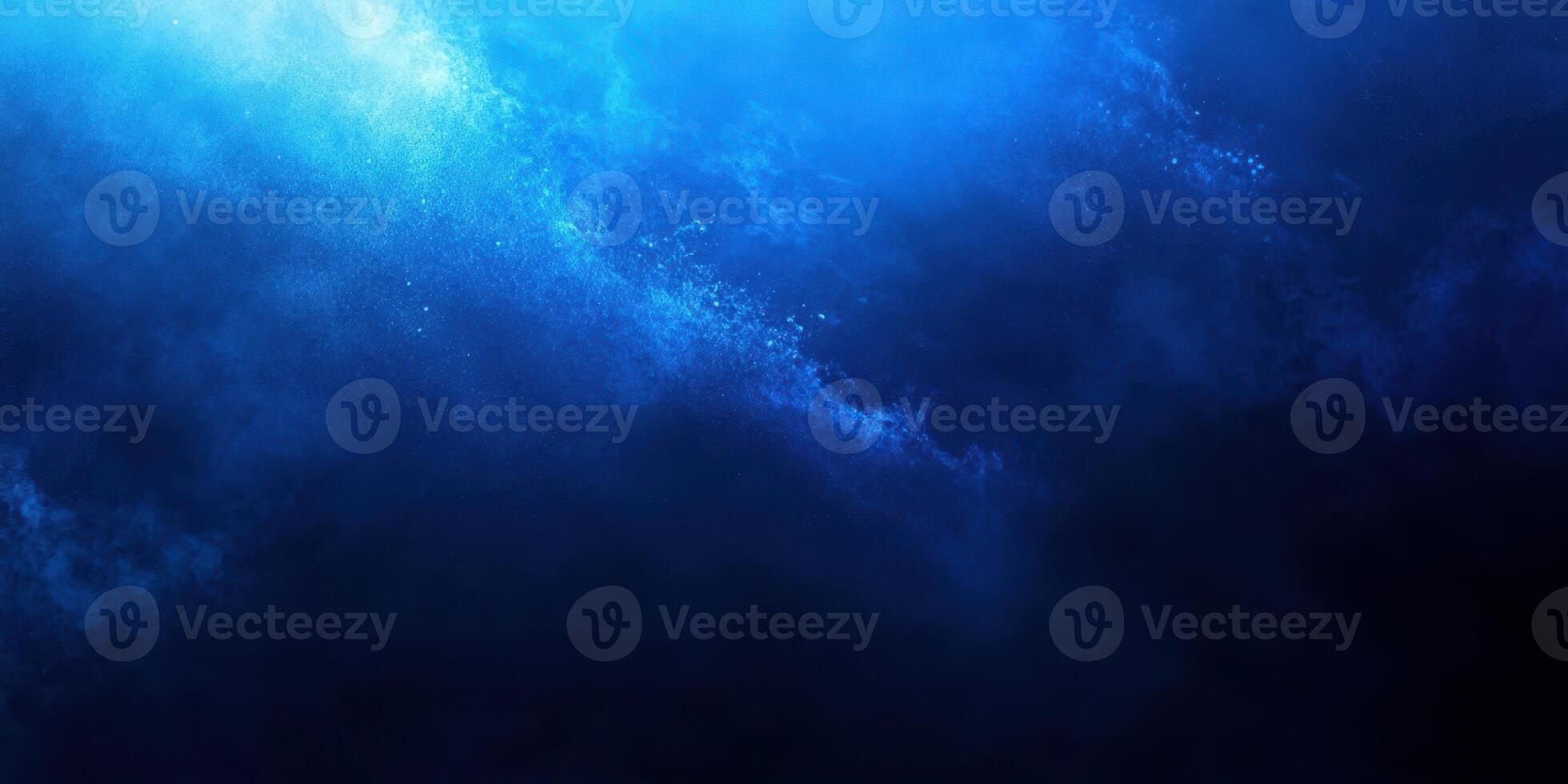 Vivid blue ocean waves crashing under moonlight at night in a tranquil setting photo