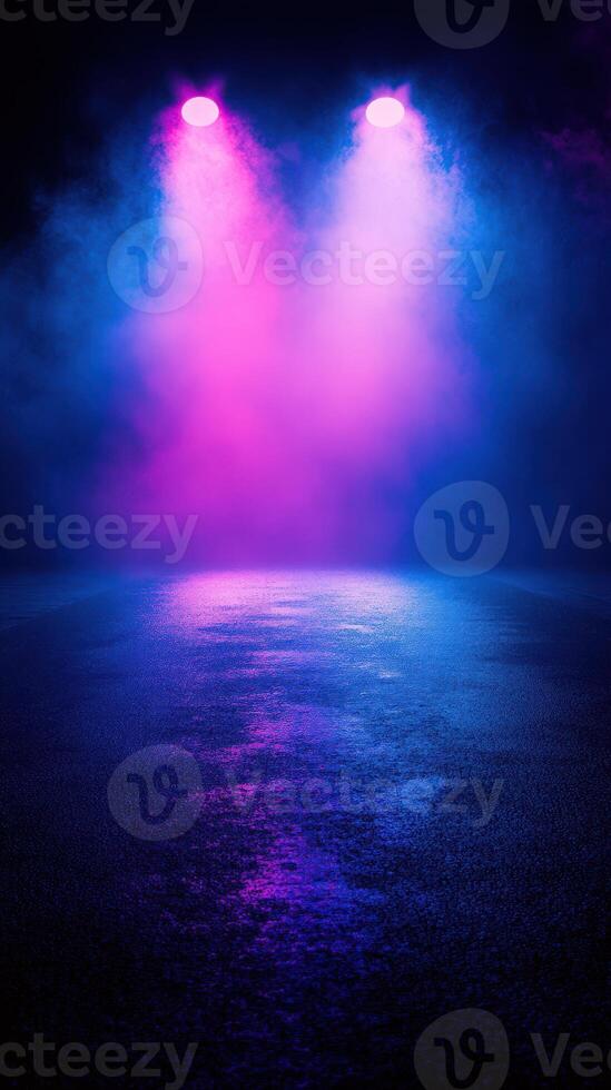 Vibrant stage lighting with pink and blue hues illuminating a reflective wet surface during a concert or performance photo