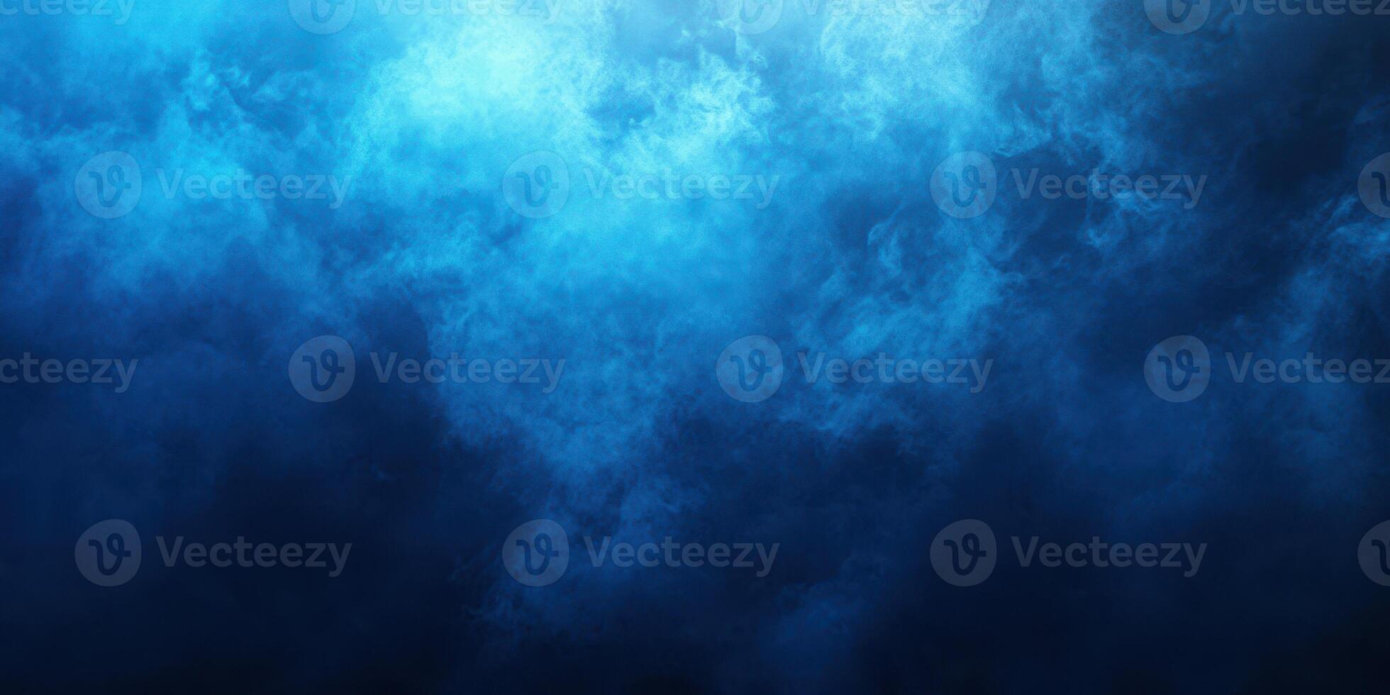 Deep blue hues swirl in a mesmerizing underwater world captured in a tranquil and serene ocean environment photo