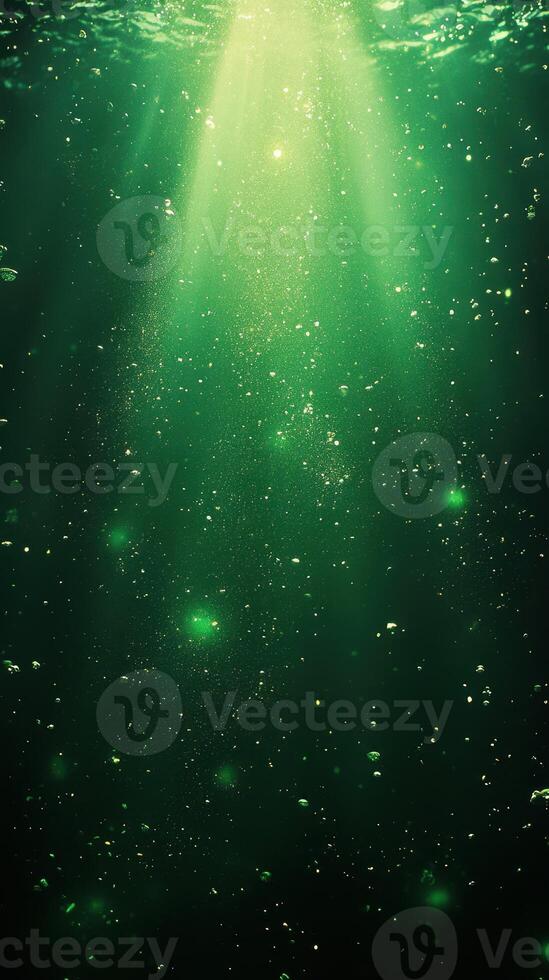 Light streams through green water creating a magical underwater atmosphere in a tranquil aquatic scene photo