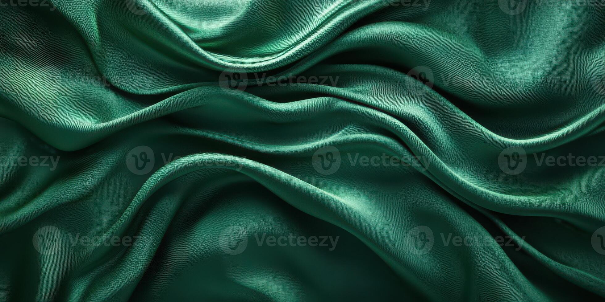 Elegant green silk fabric draping in soft waves captures the beauty of smooth textures and rich colors in natural light photo
