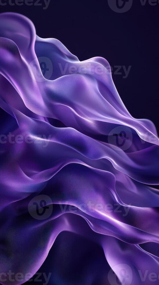 Flowing purple fabric creating a mesmerizing wave pattern against a dark background photo