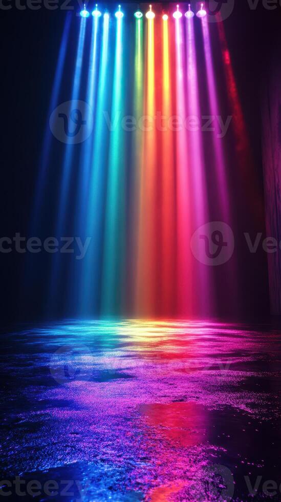Colorful beams of light illuminate a dark space creating a vibrant atmosphere reflecting on the water surface photo