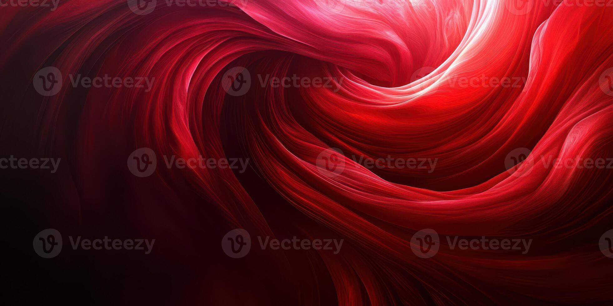Vibrant red swirling fabric creates an abstract display of motion and texture in a dark, atmospheric setting photo