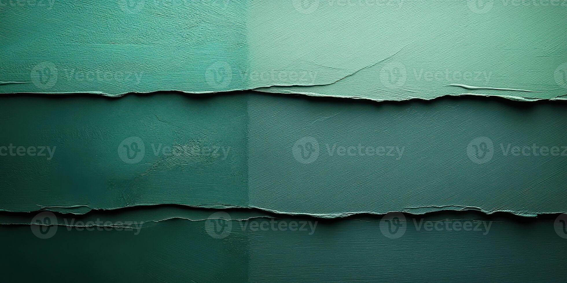 Textured teal wall with layered paint creating a vibrant, abstract design during the afternoon light photo