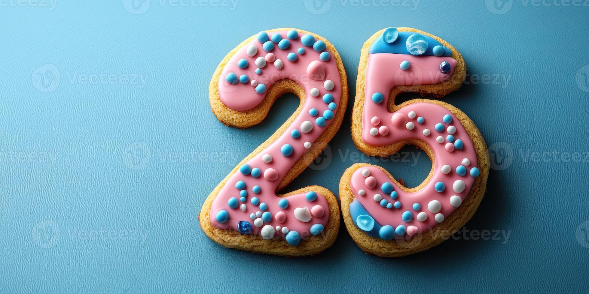 Celebration cookies designed as the number twenty-five with colorful frosting on a blue background photo
