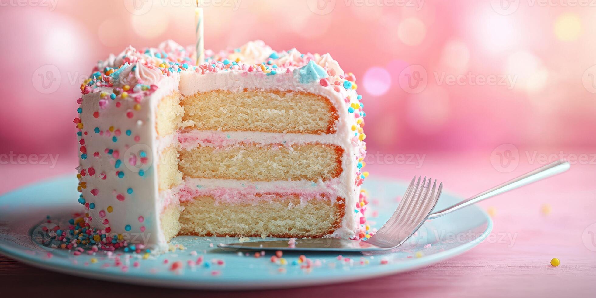 Celebrate with a delicious slice of colorful birthday cake adorned with sprinkles and a candle photo