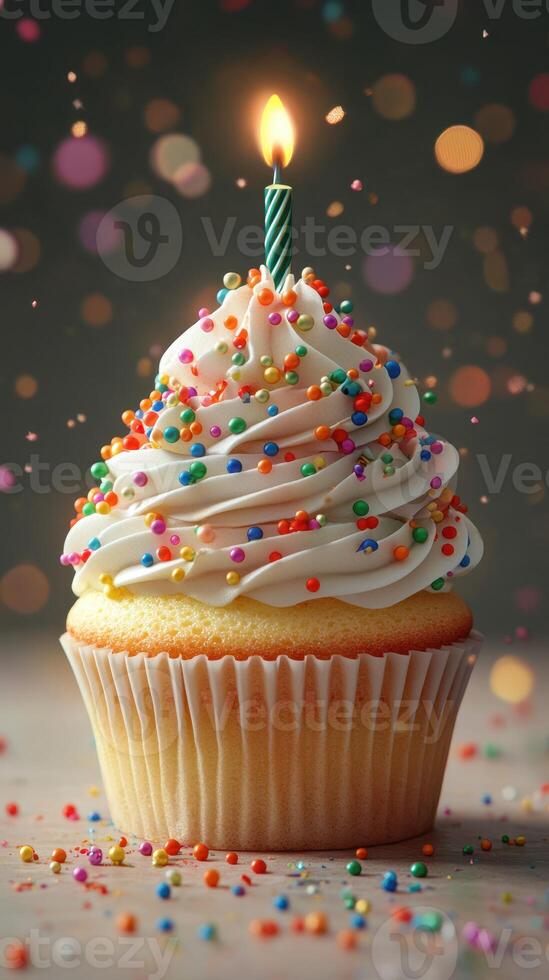 Colorful cupcake with sprinkles and a lit candle celebrates a joyful occasion at a festive gathering photo