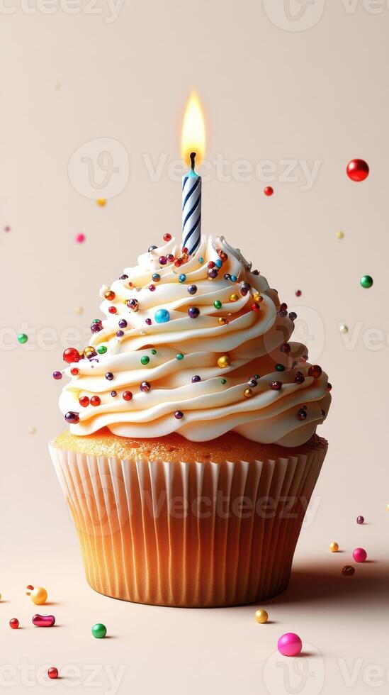 Festive cupcake with colorful sprinkles and lit candle creating a joyful birthday atmosphere photo