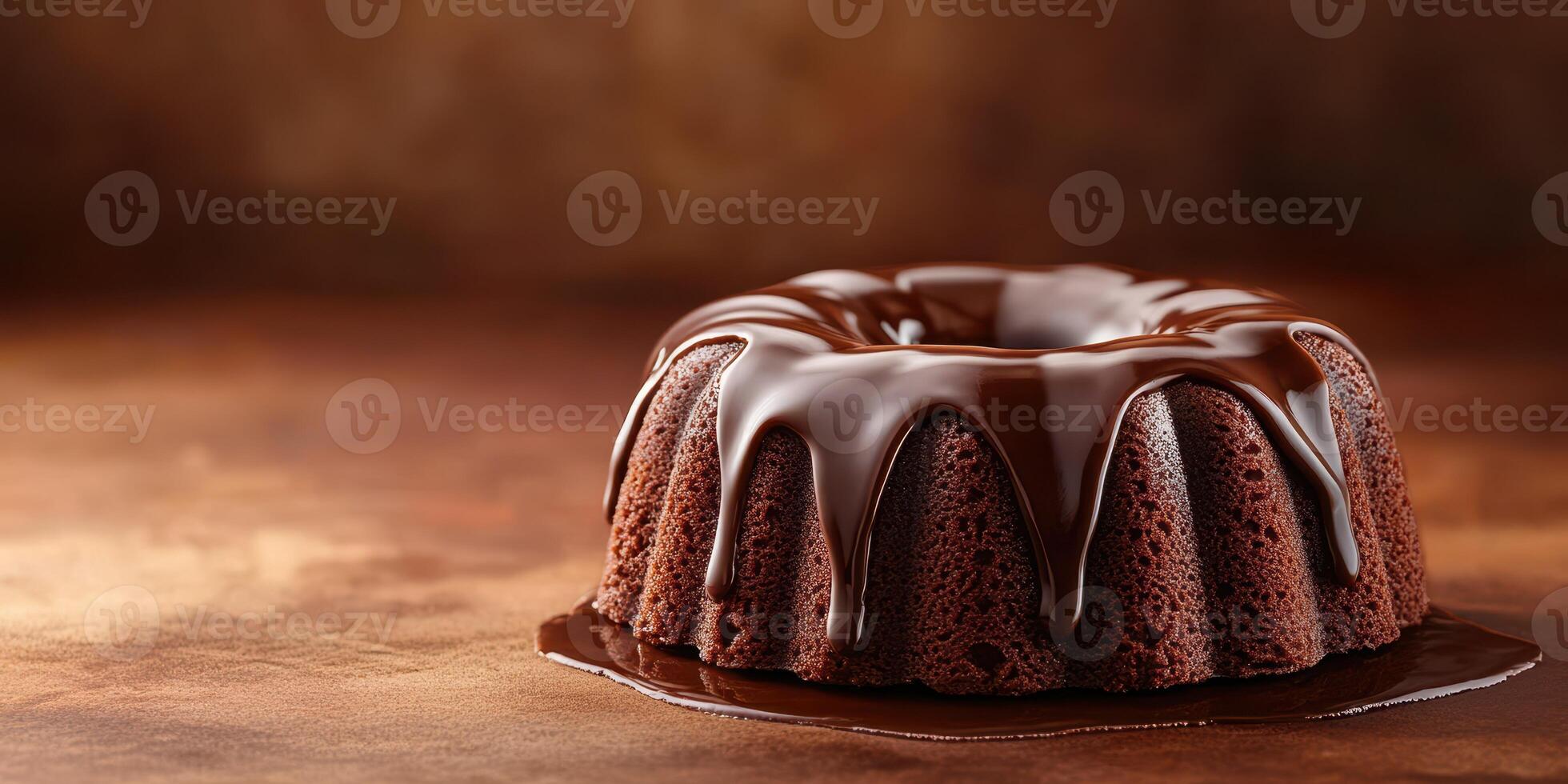 Chocolate bundt cake served on a wooden surface with rich chocolate glaze and a warm, inviting background photo