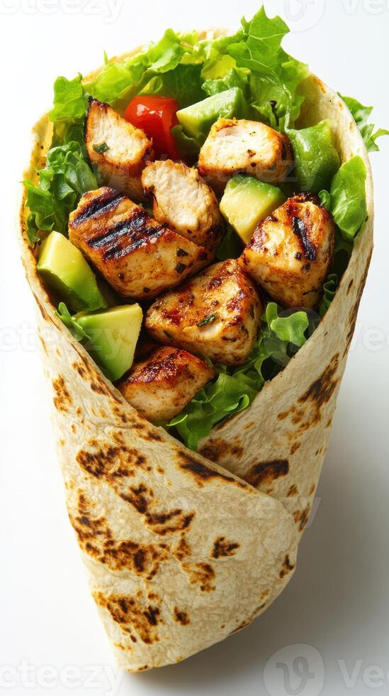 Fresh grilled chicken wrap filled with greens and vegetables ready to be enjoyed for lunch photo