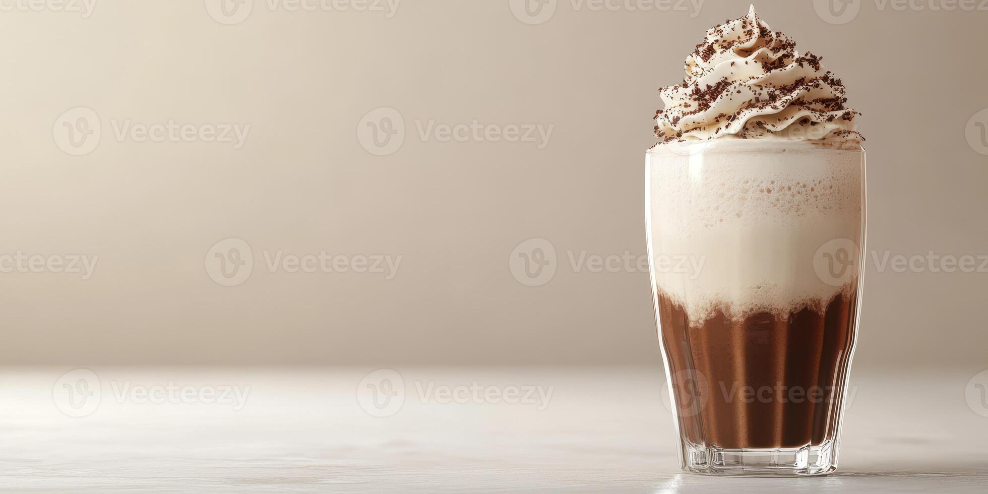 Chocolate beverage topped with whipped cream and chocolate shavings against a soft background photo