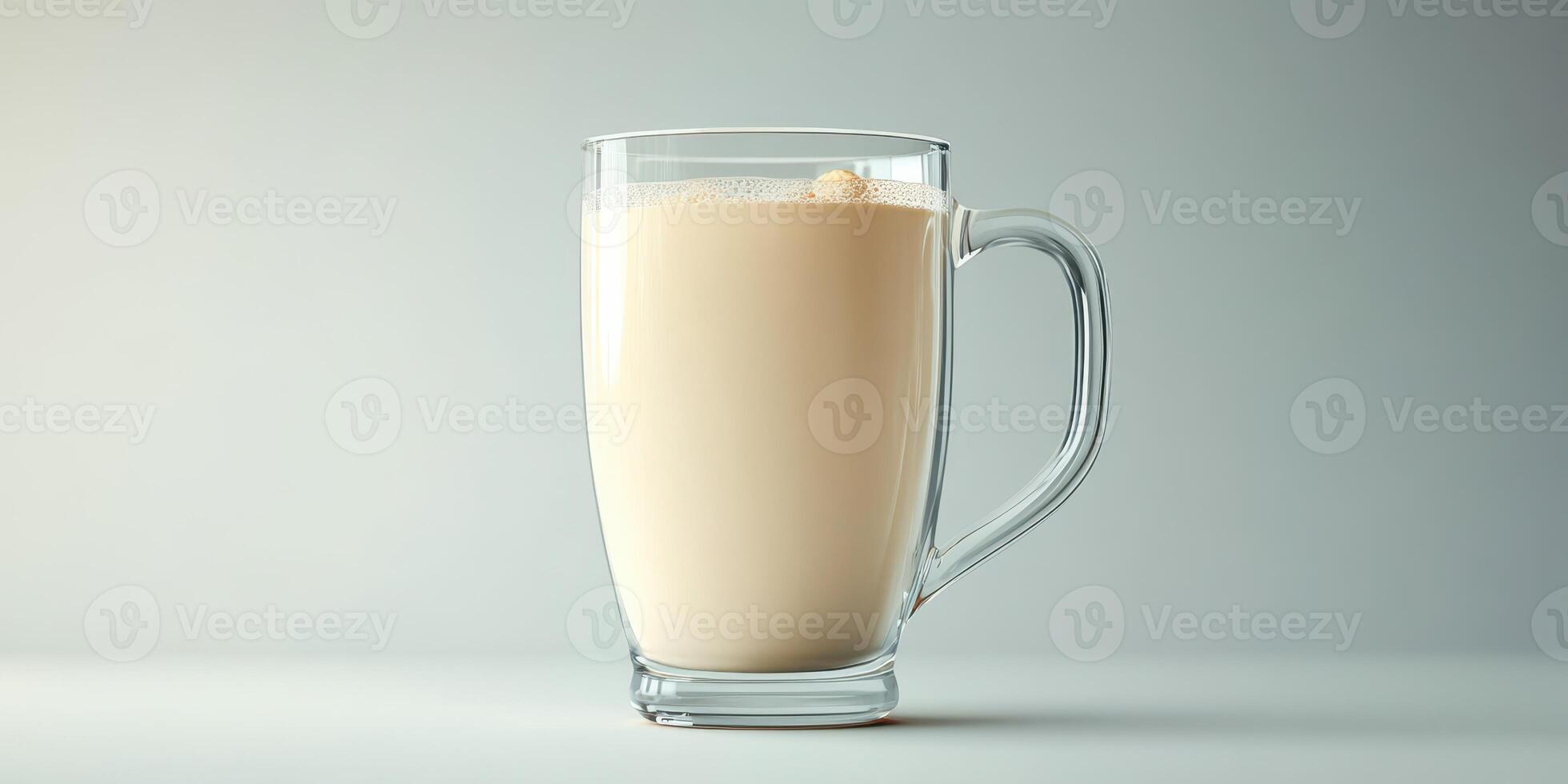 Delicious creamy latte served in a clear glass mug with a smooth frothy top on a light background photo