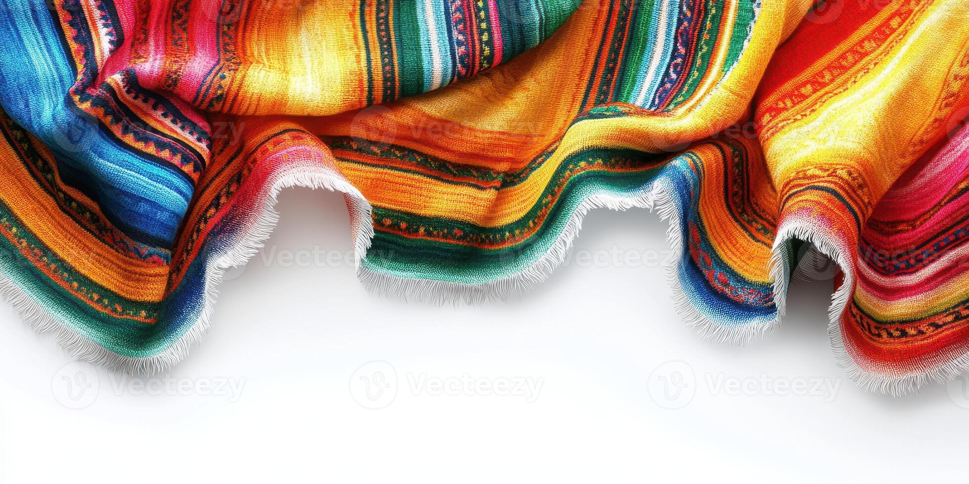 Colorful woven blanket draped elegantly on a clean surface with vibrant patterns and fringes photo