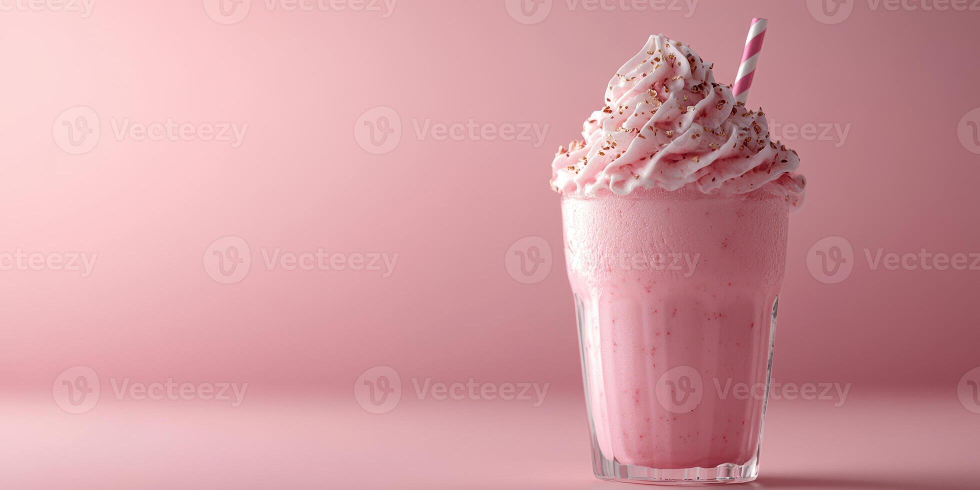 Creamy pink milkshake topped with whipped cream and sprinkles against a pastel backdrop photo