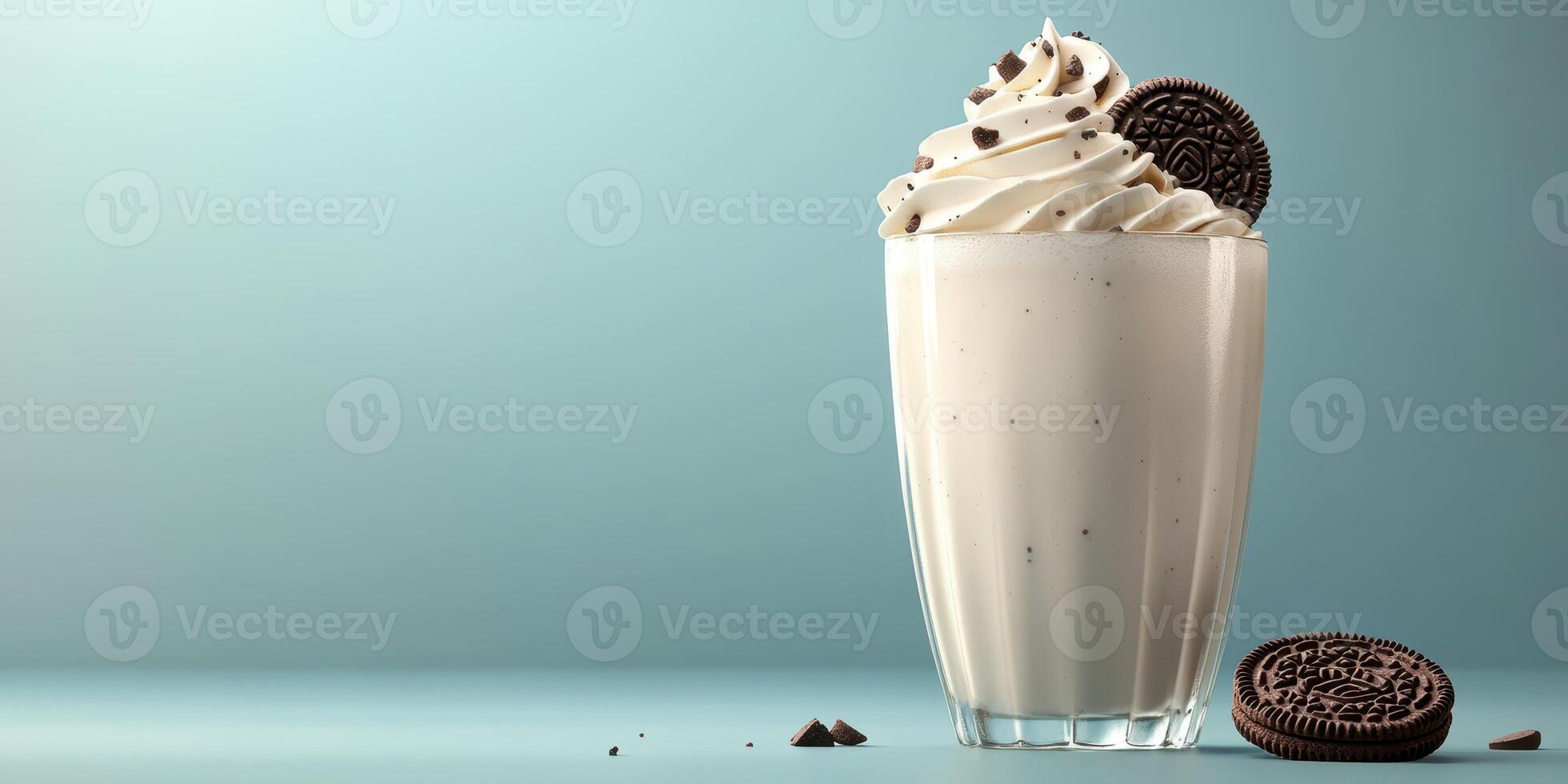 Creamy dessert shake topped with whipped cream and chocolate cookies in a stylish glass photo