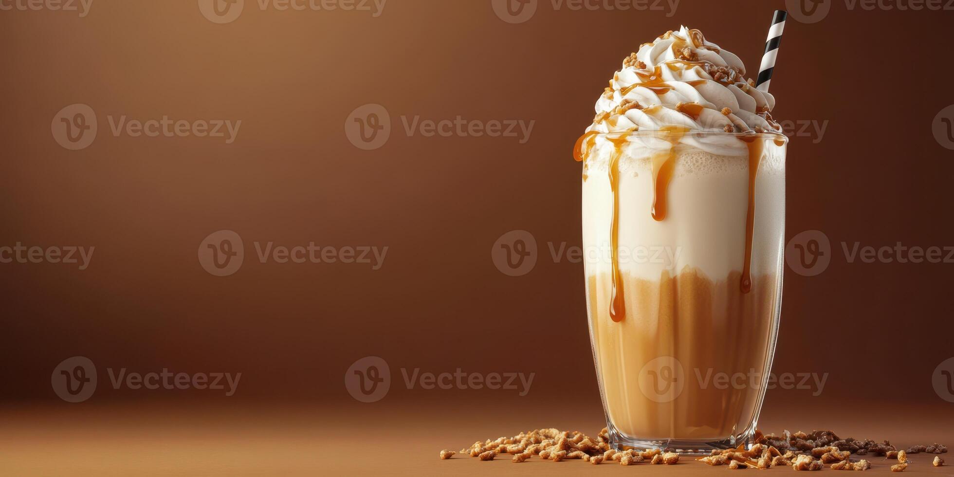 Creamy caramel frappuccino topped with whipped cream and chocolate drizzle in a cozy cafe setting photo