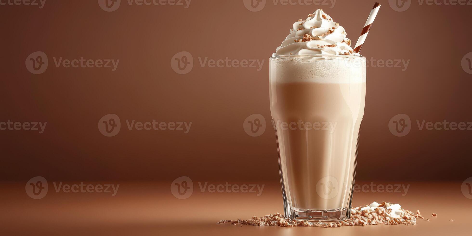 Creamy chocolate milkshake topped with whipped cream and a striped straw against a brown background photo