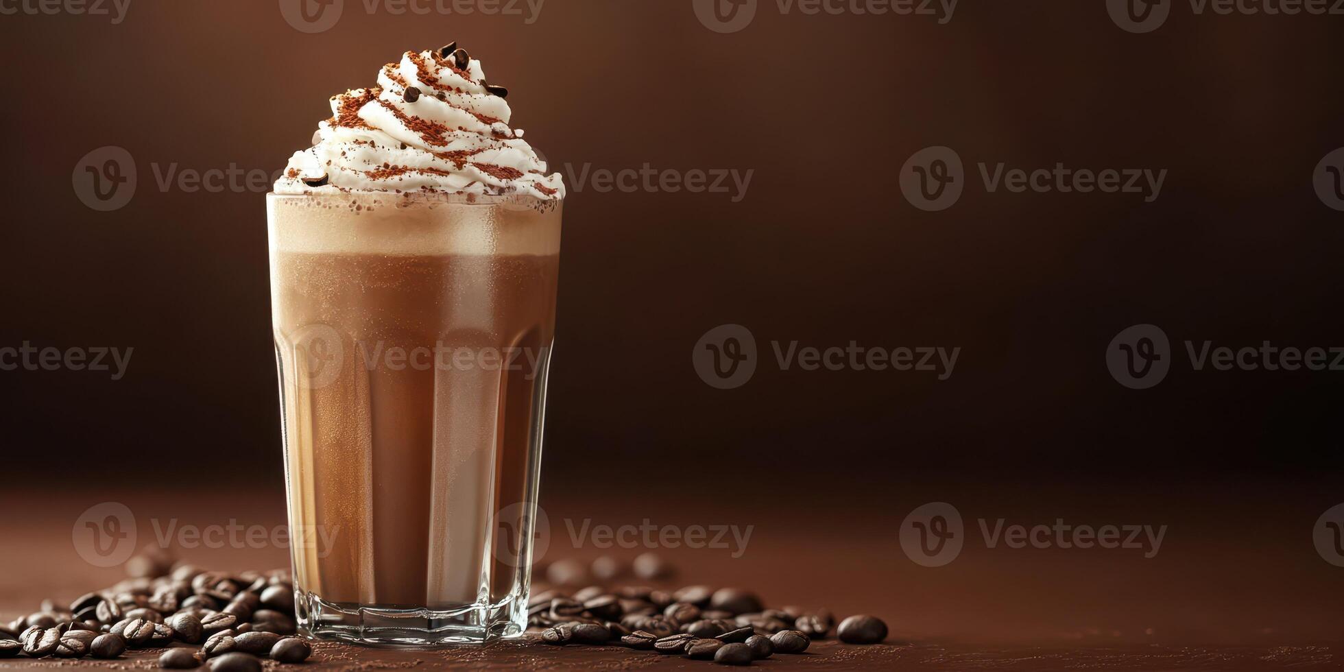 Creamy mocha topped with whipped cream and chocolate shavings served in a glass with coffee beans photo