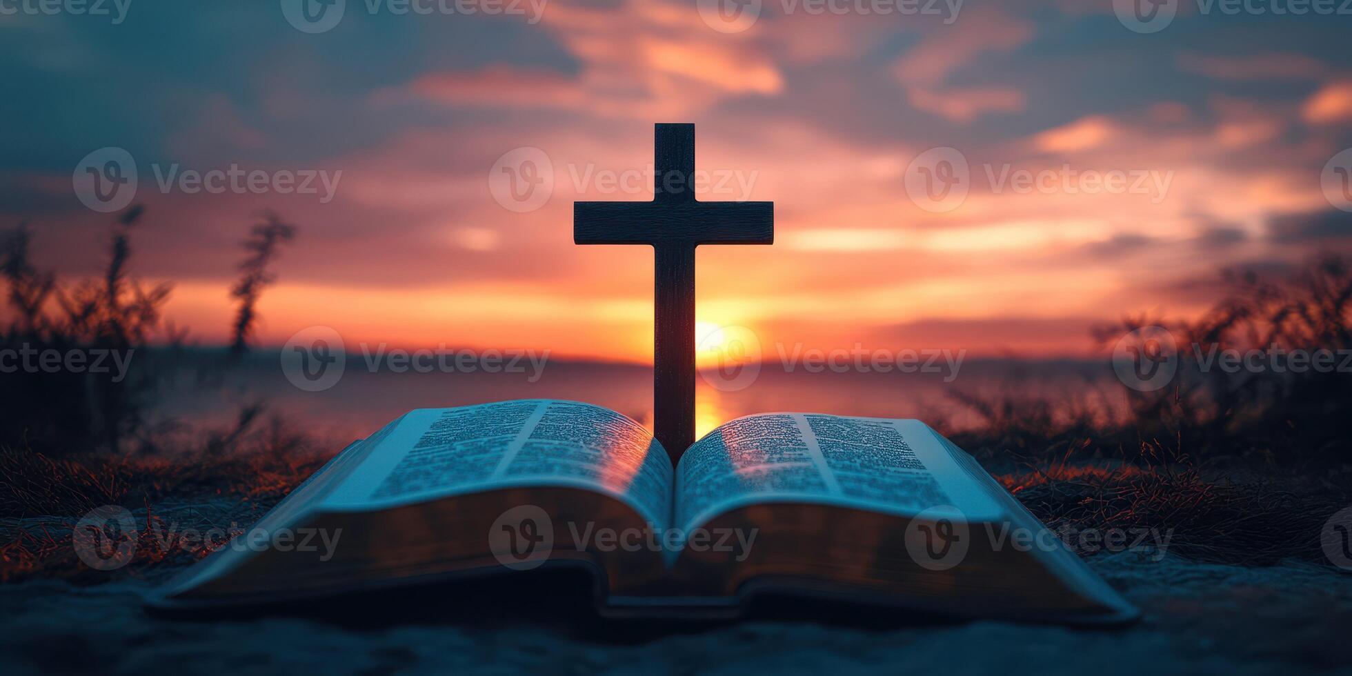 Sunset view with an open Bible and a cross silhouetted against the horizon photo