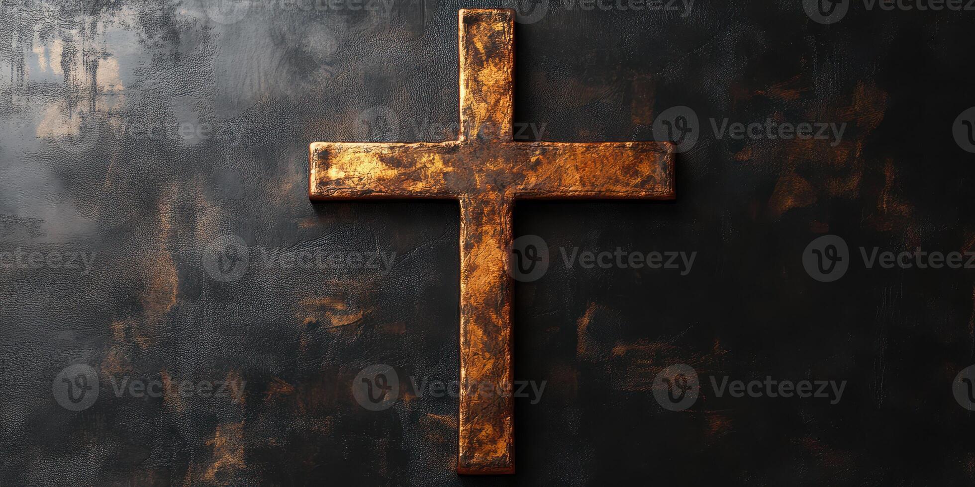 Cross made of worn metal hangs against a textured dark wall in a spiritual setting photo