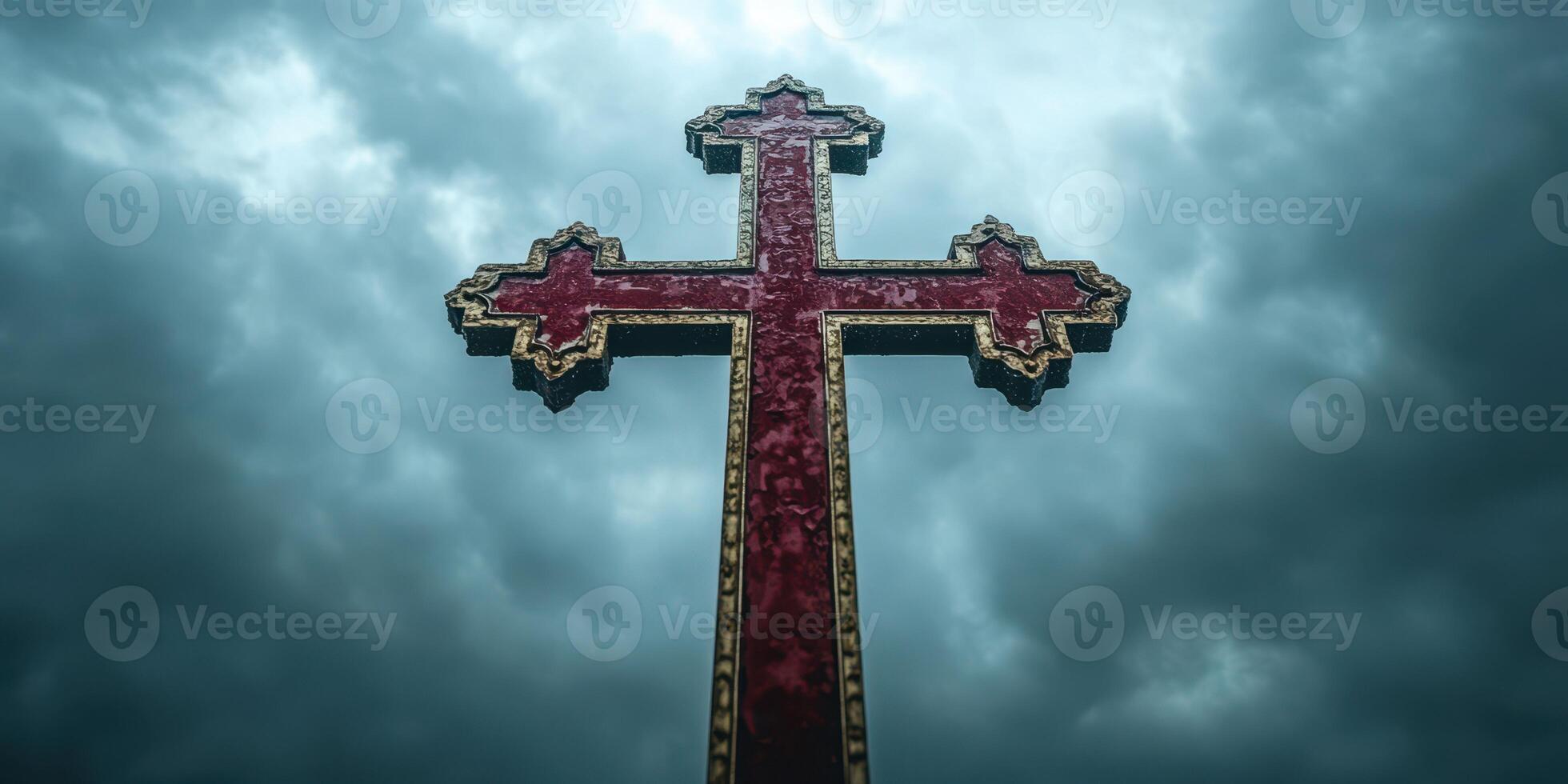 Intricately designed cross against a dramatic cloudy sky at dusk highlighting reflections of faith and art photo
