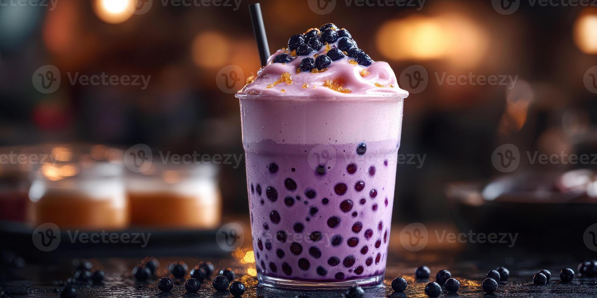 Refreshing bubble tea topped with blueberries served in a transparent cup at a cozy cafe during evening hours photo