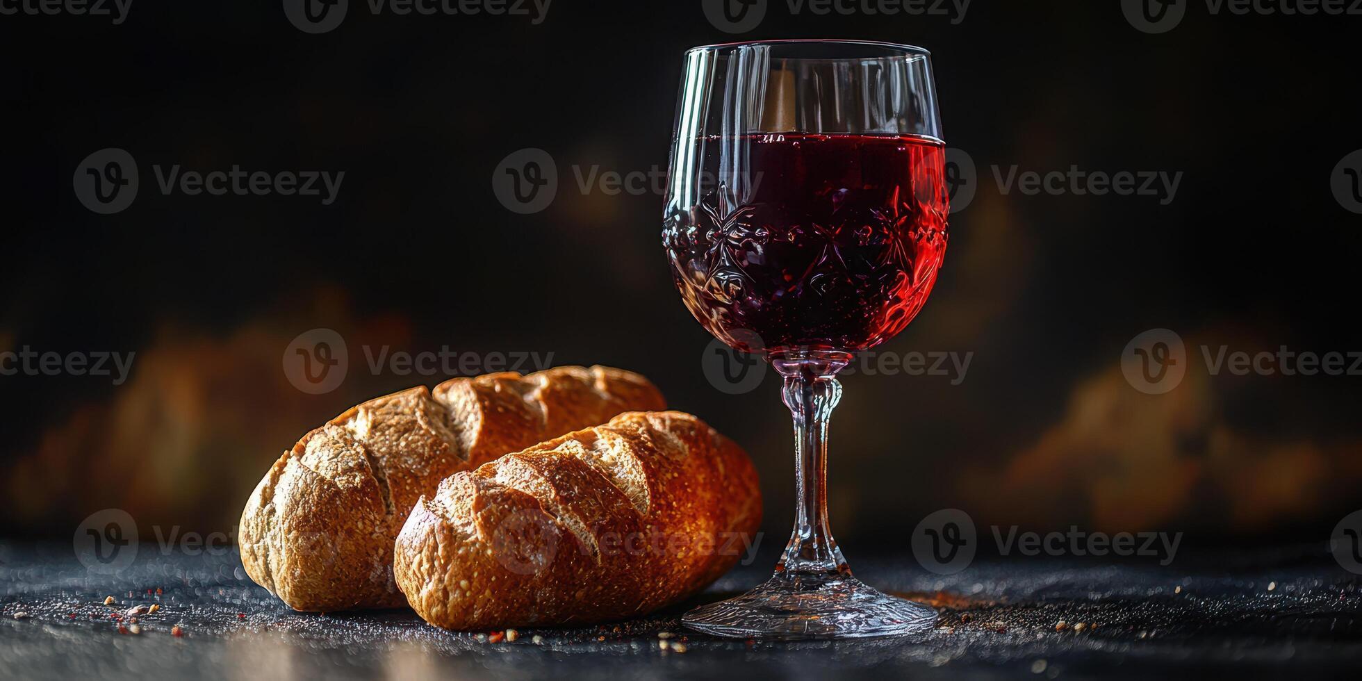 Red wine and fresh bread arranged on a rustic table for a cozy evening gathering photo