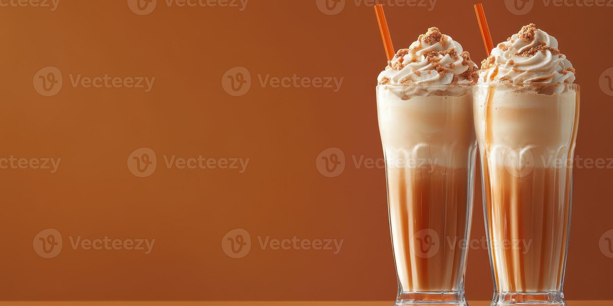 Creamy milkshakes served in tall glasses with whipped topping and caramel drizzle at a summer gathering photo