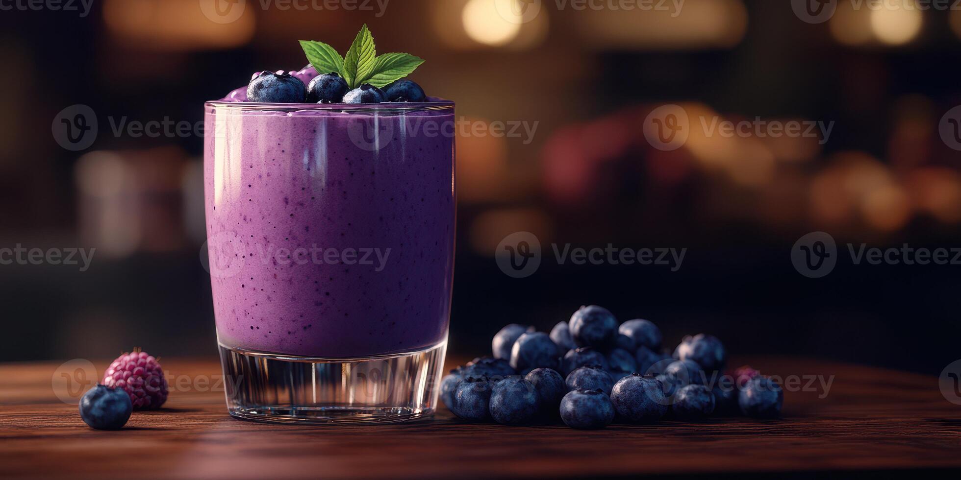 Refreshing berry smoothie served in a clear glass on a wooden surface, showcasing vibrant colors and fresh ingredients photo