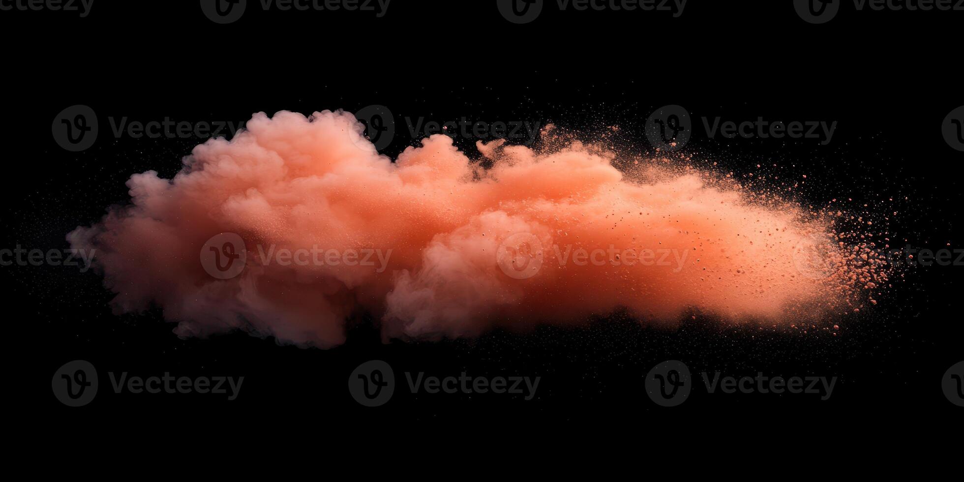 Colorful cloud of orange powder dispersing in the air against a black background photo