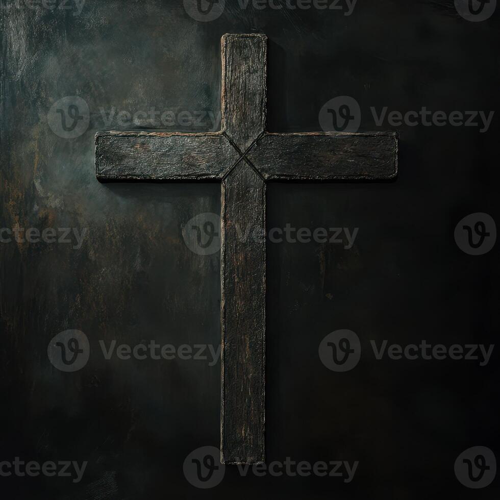 Black wooden cross against a dark background showcasing a simple yet profound religious symbol photo